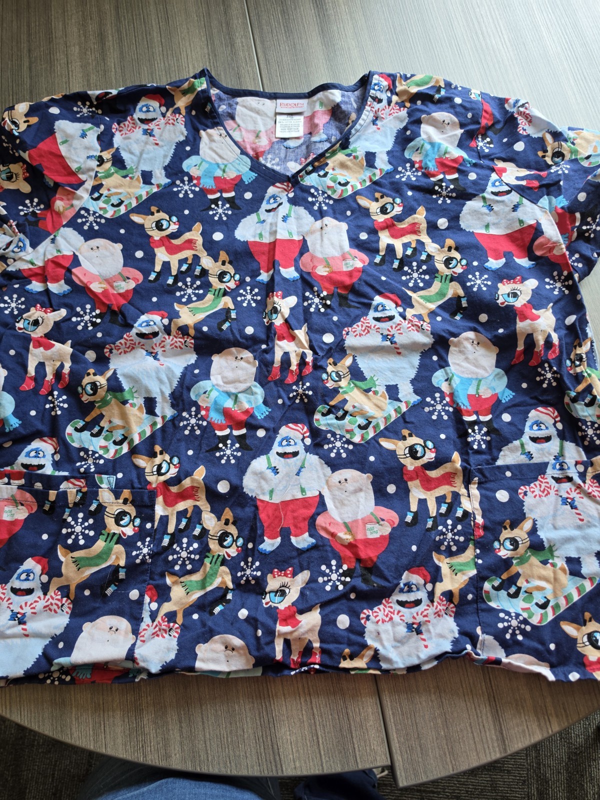 Rudolph the Red-Nosed Reindeer Women’s 3XL Blue/Multicolor Holiday Scrub Top