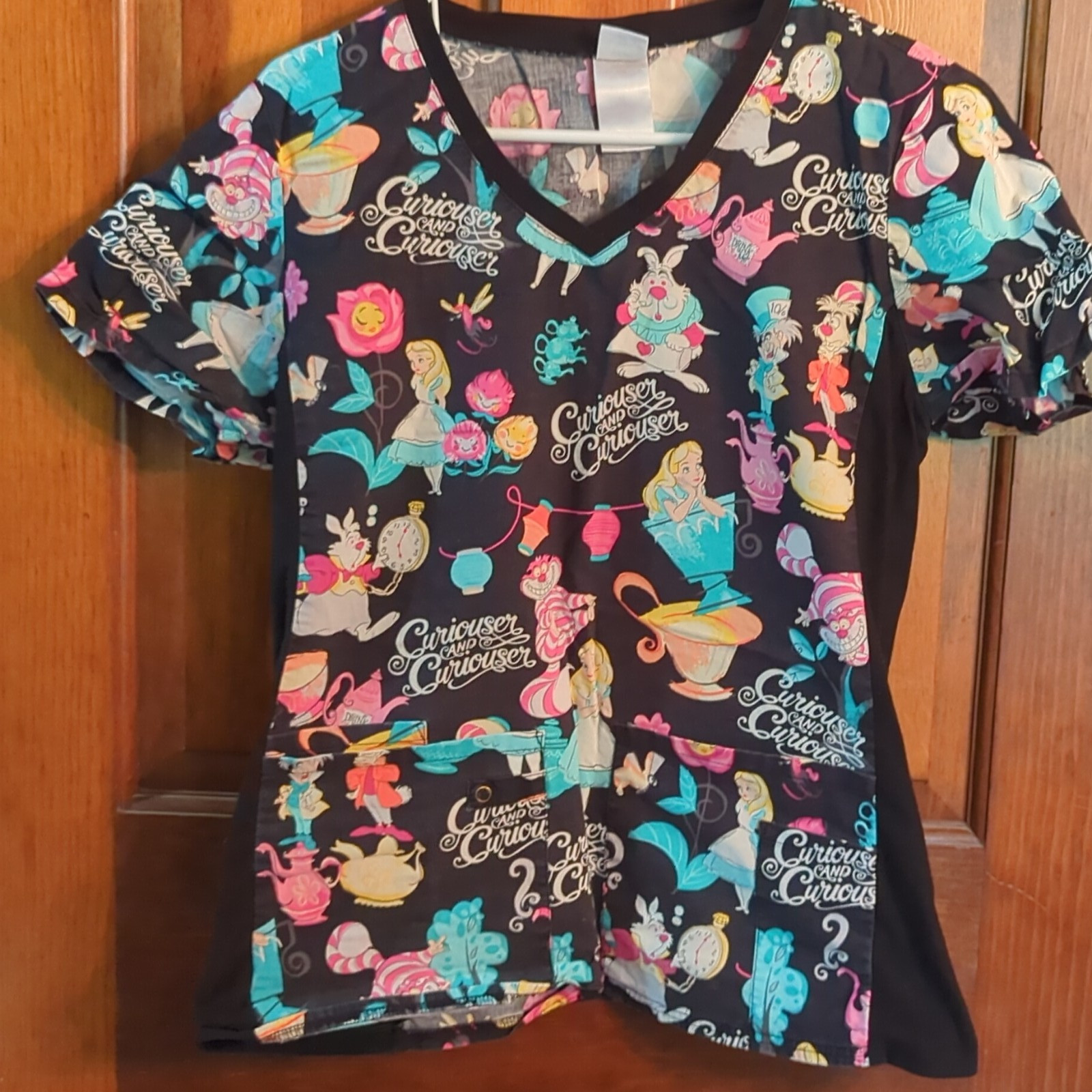 Disney Women’s Black Multicolor Patterned Medical Scrub Top Alice in Wonderland