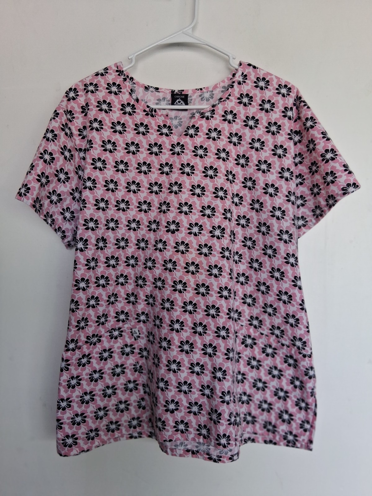 Cherokee sz L scrub top in pink w/ black white floral print, back tie. Very good
