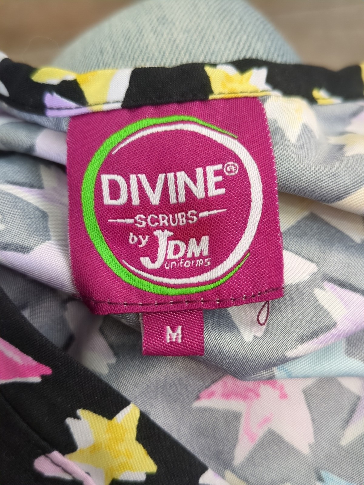 Divine Stretch by JDM Women’s Size Medium Black Stars Nurse Stretch Scrub Top
