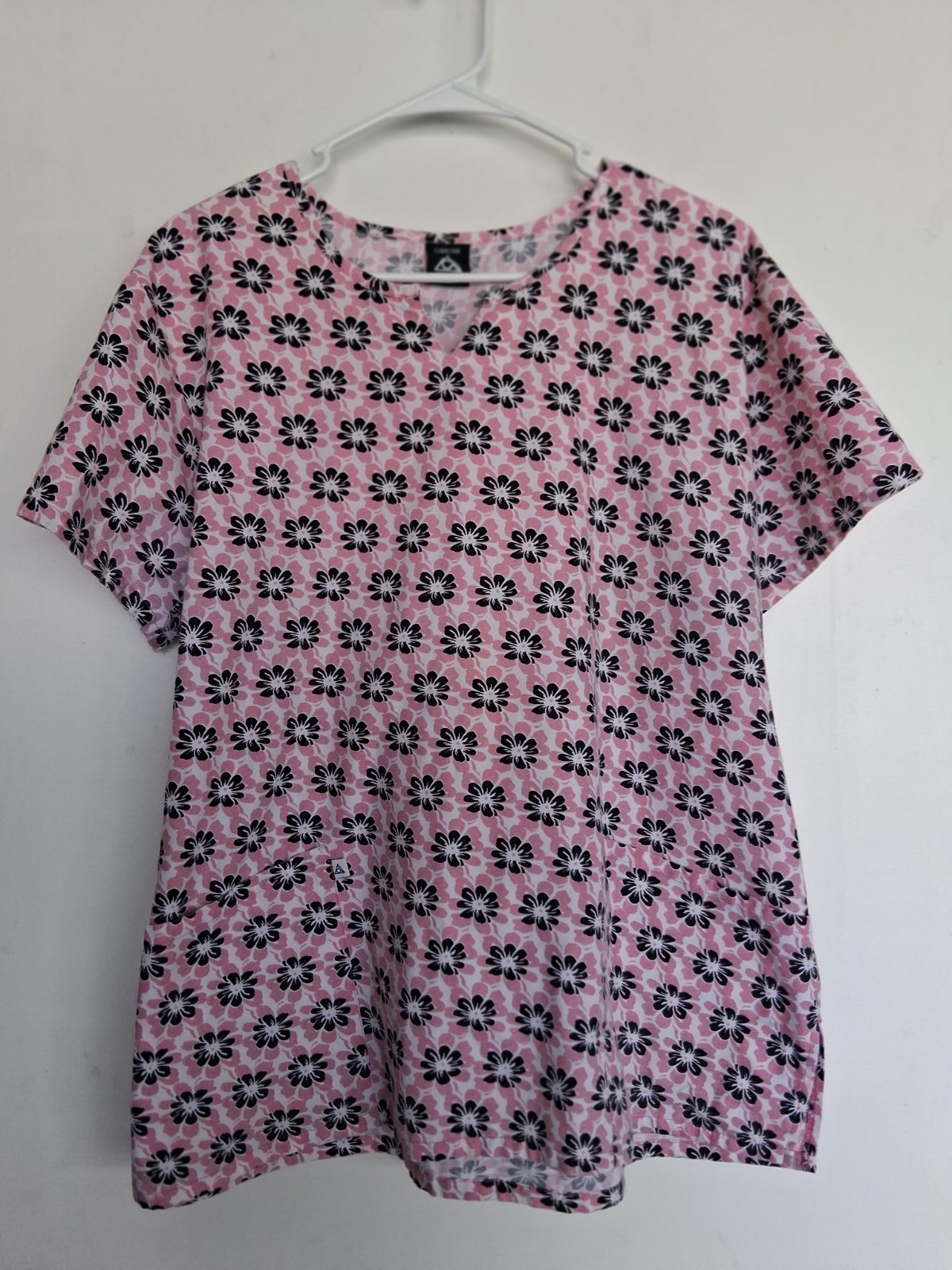 Cherokee sz L scrub top in pink w/ black white floral print, back tie. Very good