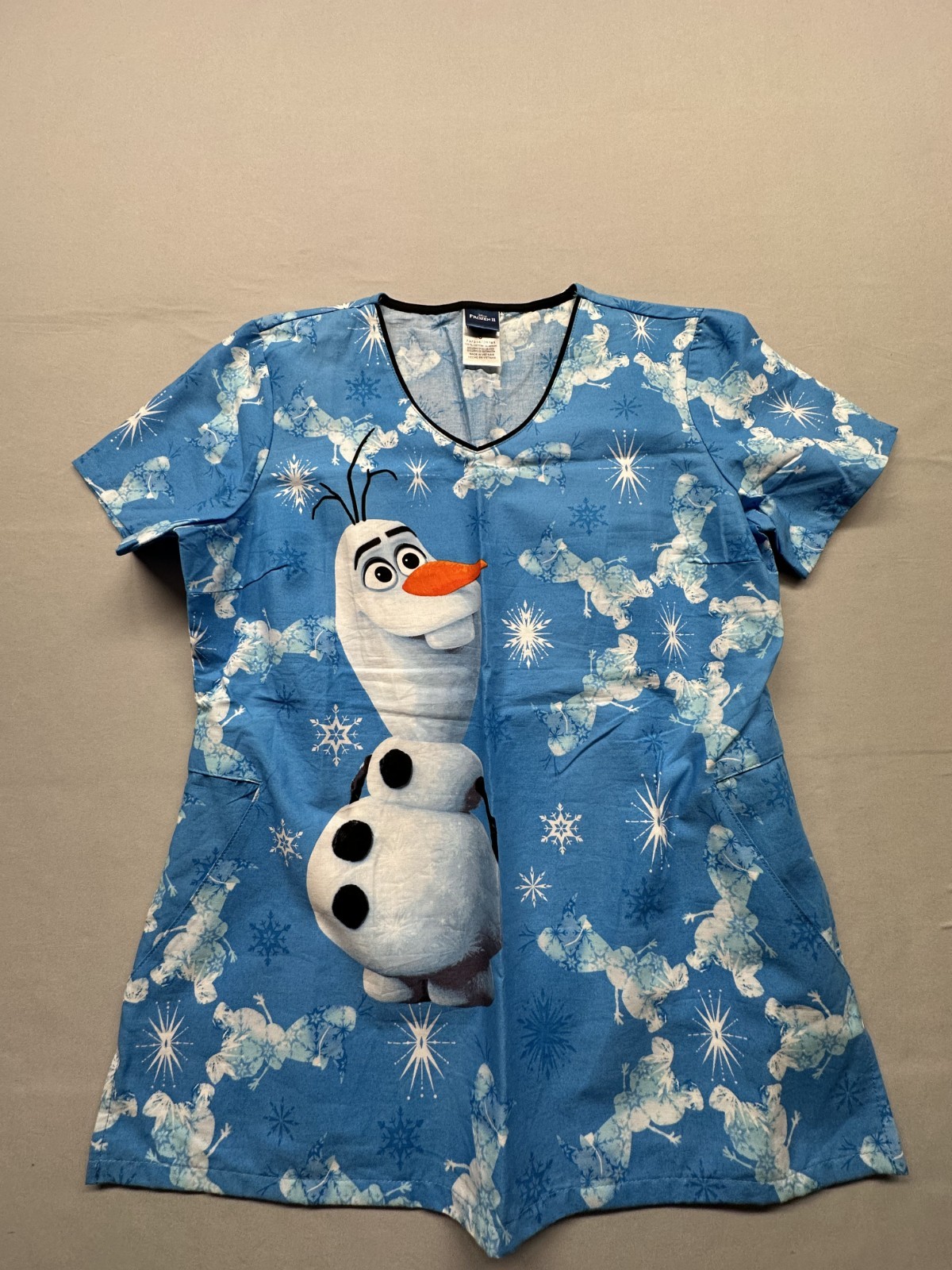 Olaf Tooniforms Licensed Frozen V Neck Scrub Top (TF626 FZIB), Size Small.
