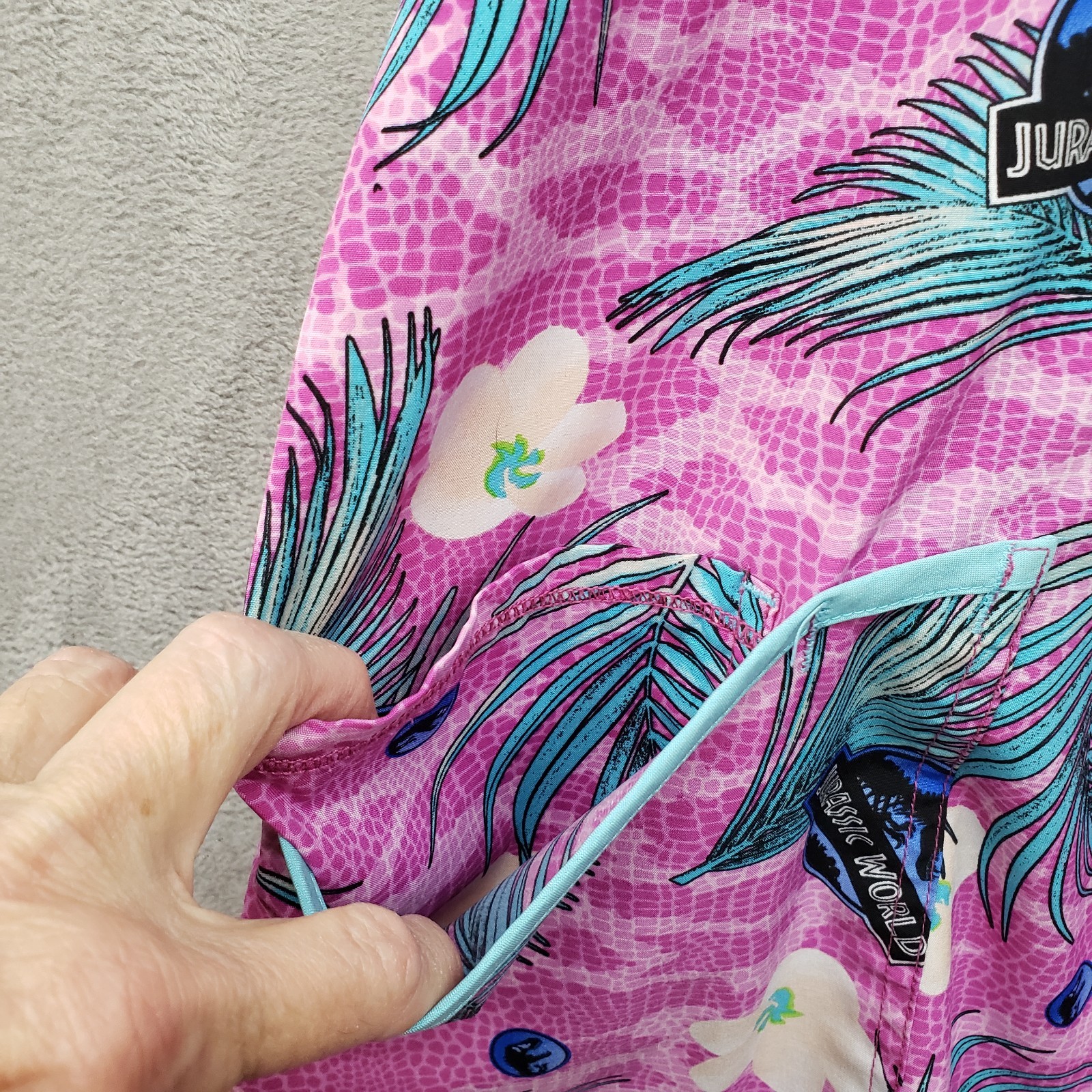 Jurassic World Dominion Women’s Scrub Top Large Pink Floral Dinosaur Print